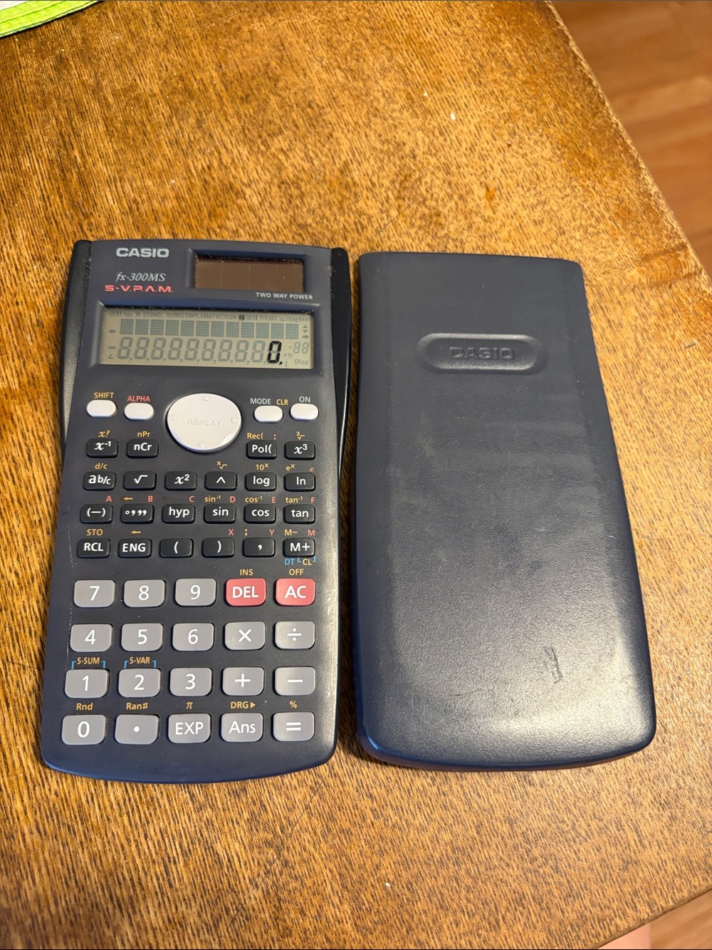 Calculator on Wooden Surface